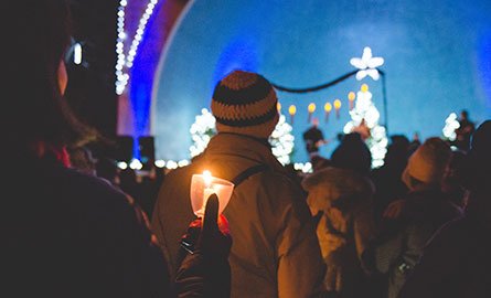 people gathered with candles